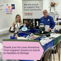 Two people stood behind a table with donations. Behind them is a banner that says "We are proud to support the local community" with the Tesco logo. Text on the image reads "Thank you for your donation. Your support means so much to families in Refuge". Safenet logo is overlayed in the top left-hand corner.